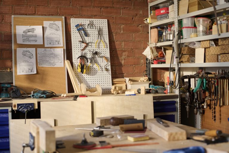Carpenters Workshop with Tools and Wooden Models on Shelves