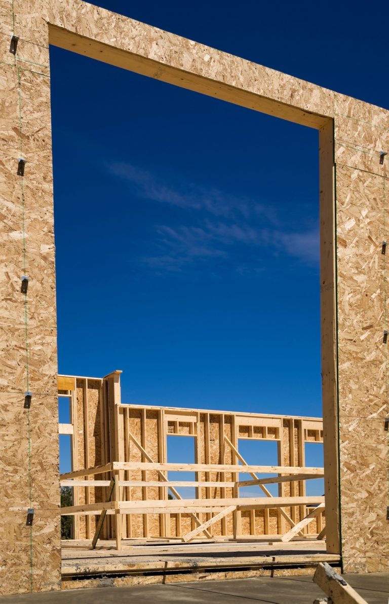 Exterior and interior walls of residential cottage style home under construction, Quebec, Canada